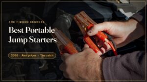 Hands connecting jump starter clamps to a car battery